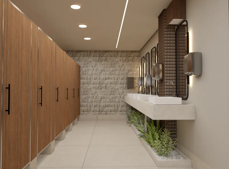 Banheiro comercial com parede de pedra, cabines em madeira e vegetação - Projeto comercial Arquiteta Melissa