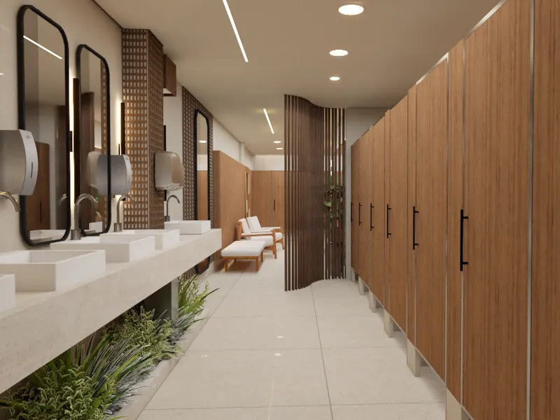 Banheiro comercial de shopping com bancada em pedra, cabines amadeiradas e paisagismo - Projeto comercial Arquiteta Melissa