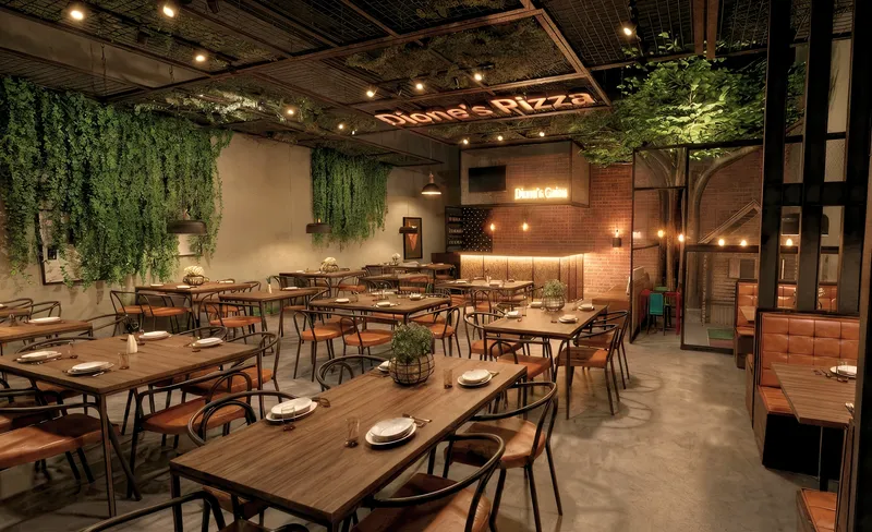 Salão interno de pizzaria com jardim vertical, tijolinho e iluminação aconchegante - Projeto comercial Melissa Colenghi