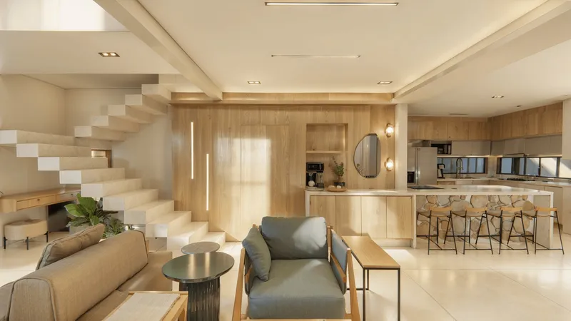 Sala de estar ampla com parede de pedra natural, piano e pé-direito alto - design de interiores em Ribeirão Preto por Melissa Colenghi